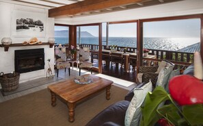 Luxury Villa, Sea View | Living area | 40-inch TV with satellite channels - Penguins View Guesthouse (Cape Town)