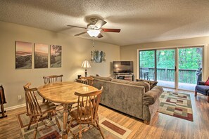 Enjoy a comfortable stay in this well-appointed living space with a dining area, sofa, and television.