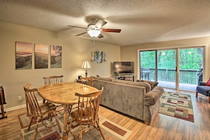 Enjoy a comfortable stay in this well-appointed living space with a dining area, sofa, and television.