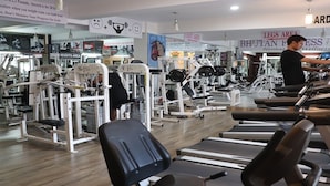 A gym with various exercise equipment, including treadmills and weight machines. - Hotel River Valley (Thimphu)