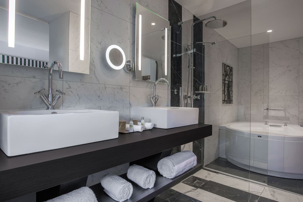 separate bathtub and shower, free toiletries, hair dryer, bathrobes