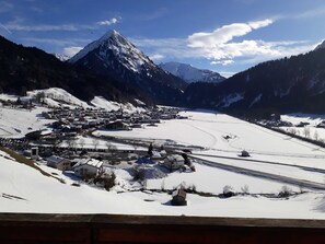 A snow-covered mountain village with buildings and a road. - Double room new (type A) Z-NR. 4 - Greber Christine - Bed and breakfast (Schoppernau)
