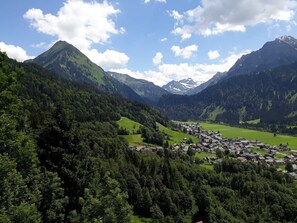 A mountainous landscape with a village nestled in a valley. - Double room new (type A) Z-NR. 4 - Greber Christine - Bed and breakfast (Schoppernau)