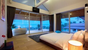 A modern bedroom with a large bed, a view of the outdoors, and a wooden ceiling. - 6 Bedroom Luxury Sea View Villa Moonrise SDV079B-By Samui Dream Villas (Koh Samui)