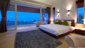 A modern bedroom with a large bed, a view of the ocean, and a balcony. - 6 Bedroom Luxury Sea View Villa Moonrise SDV079B-By Samui Dream Villas (Koh Samui)