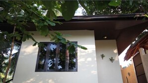 A modern building with a large window, a small balcony, and a door. - 1 Bedroom Beach Bungalow Koh Phangan SDV235-By Samui Dream Villas (Ko Pha-ngan)