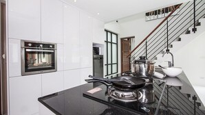 A modern kitchen with a built-in oven, a stove, and a sink. - 6 Bedroom Twin Villas Ban Tai near Beach SDV260/261-By Samui Dream Villas (Koh Samui)