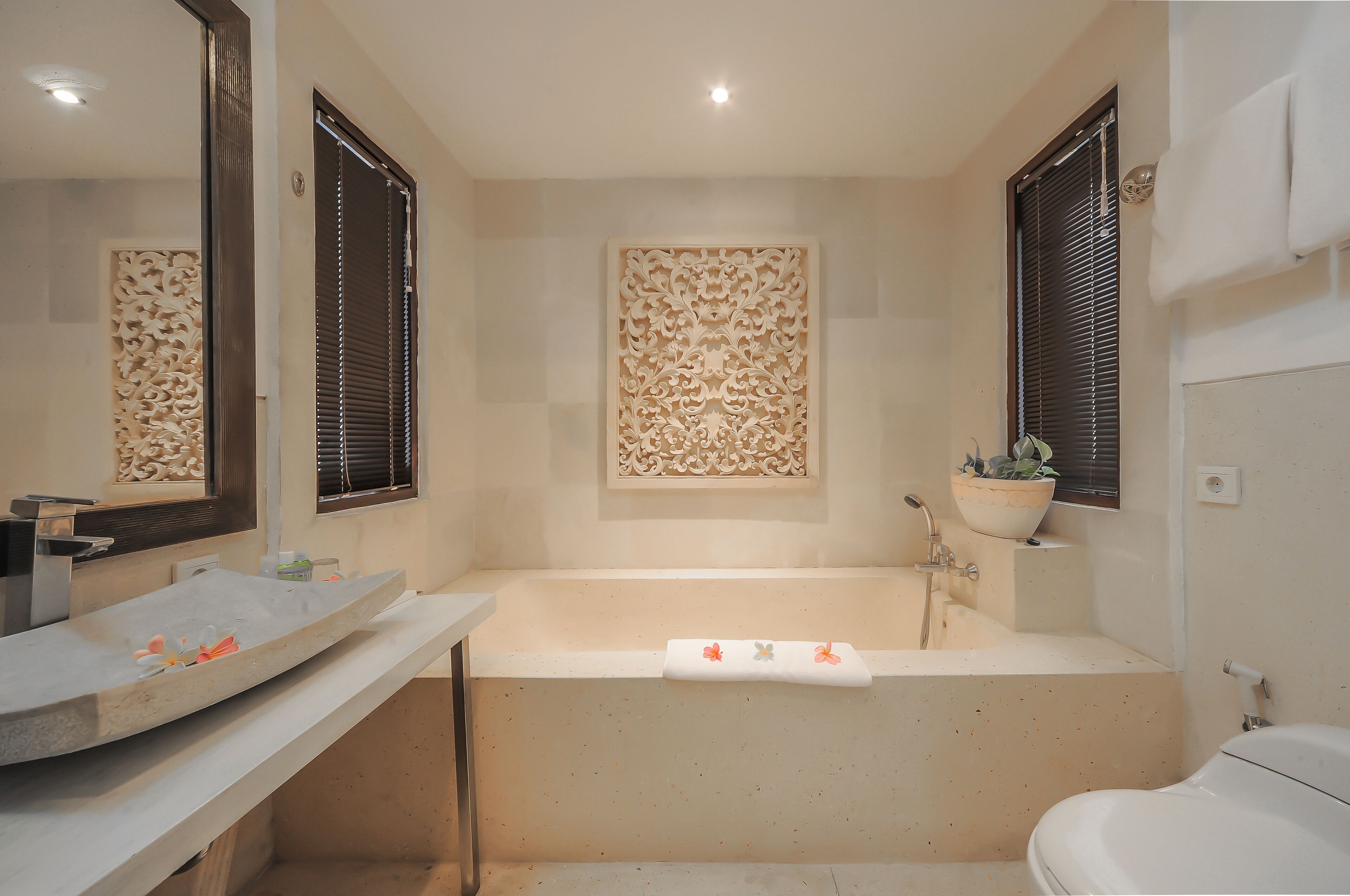 A bathroom with a bathtub, a sink, and a toilet.