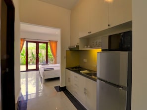 Full-size fridge, microwave, stovetop, electric kettle