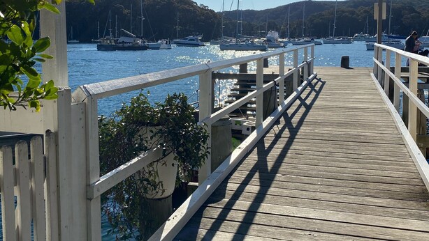 A wooden pier leading to a marina with boats and a clear sky. - Studio minutes from Waterfront walks, close to Pasadenas, cafes, restaurants  (Bayview)