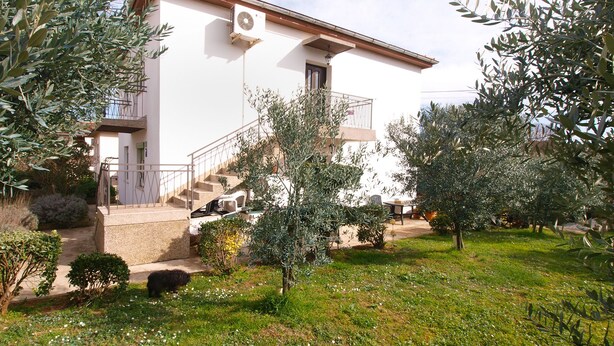 A two-story building with a white exterior, a balcony, and a staircase leading to the upper floor. - Apartment 2010/28524 (Istria - Stinjan), 1250m from the beach (Stinjan)