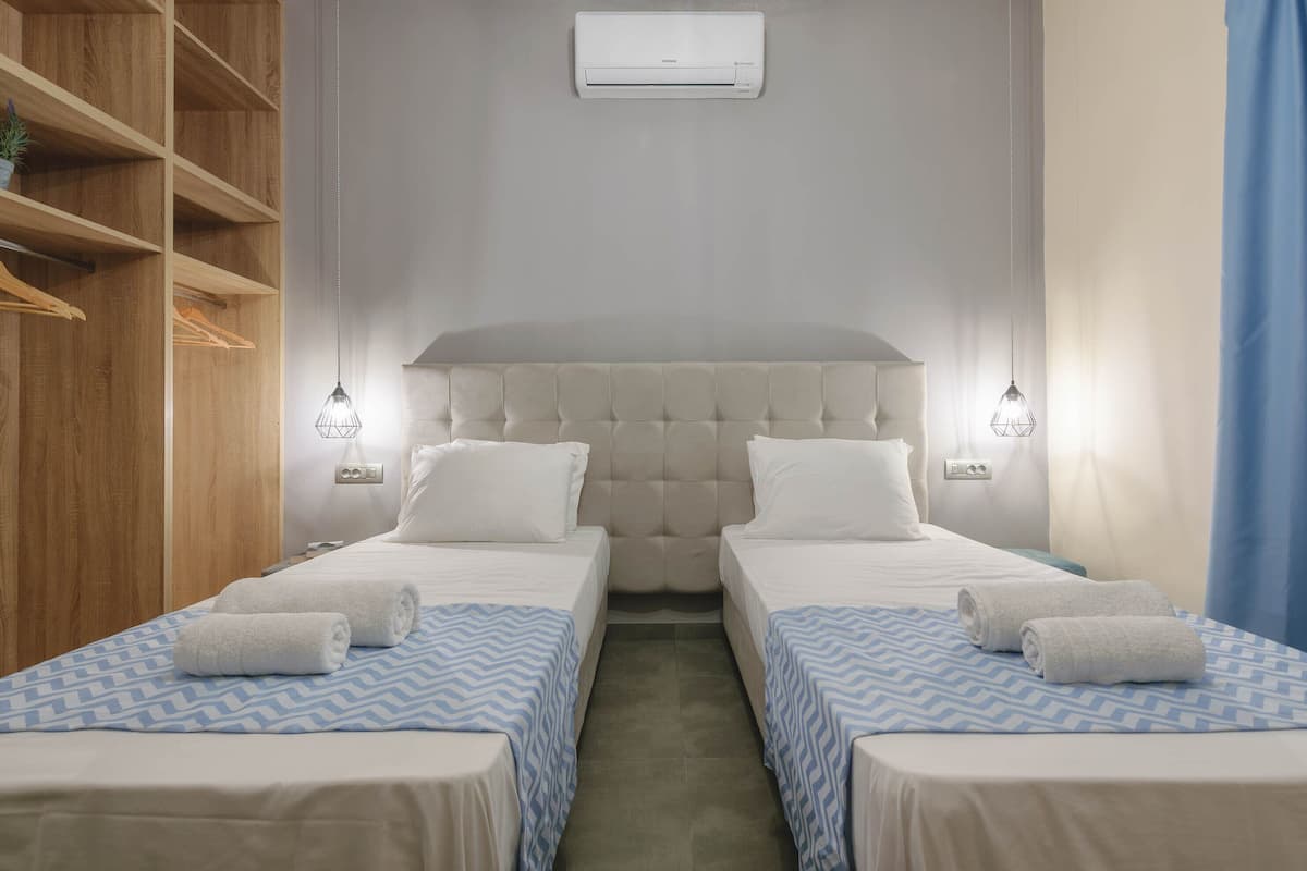 Triple Room, City View | In-room safe, iron/ironing board, free WiFi, bed sheets