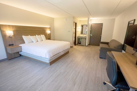 Down comforters, desk, laptop workspace, blackout drapes. Superior Stay Hotel