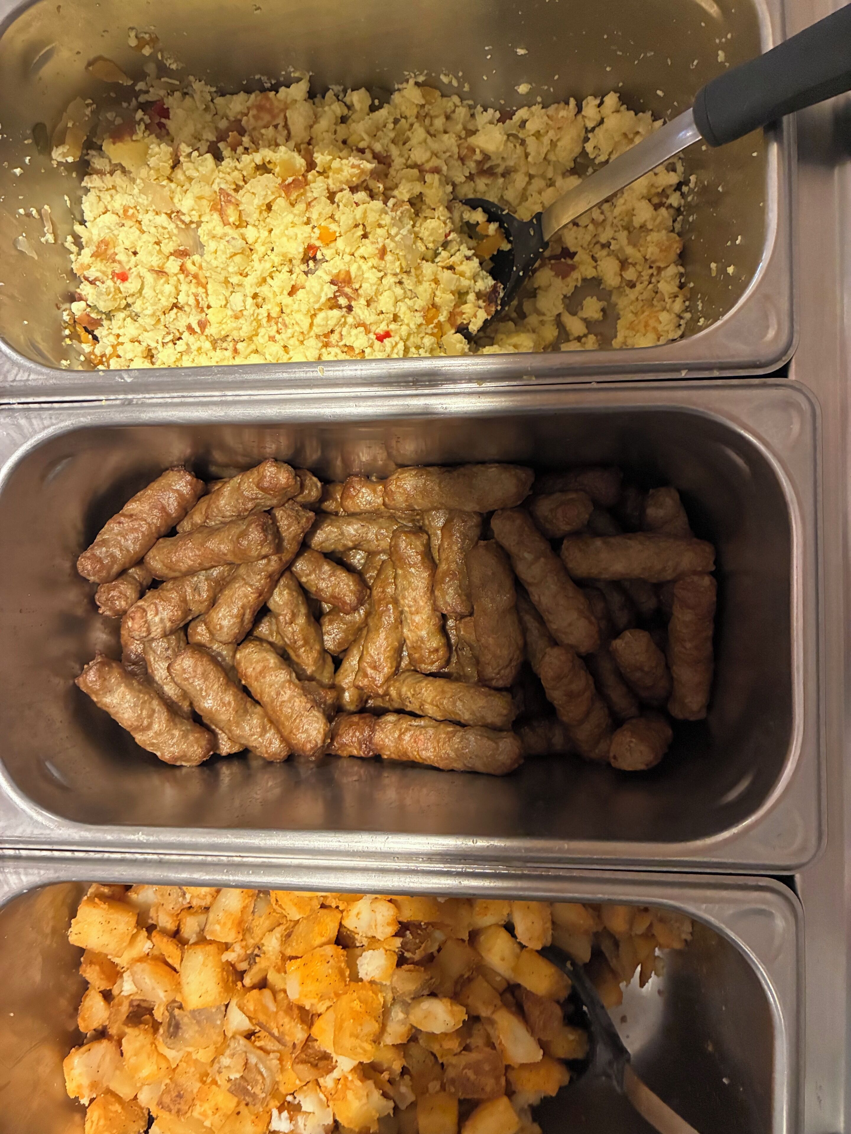 Three food containers with different dishes.