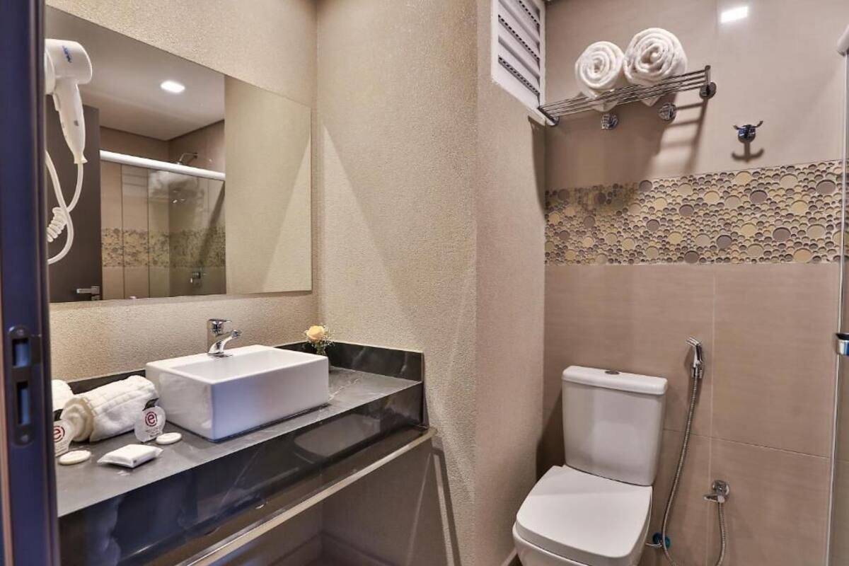 standard double room, 1 king bed | bathroom | shower, hair dryer, towels, soap