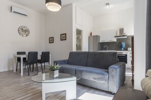 Apartment, 2 Bedrooms | Living area | 32-inch LCD TV with digital channels, TV - Via Mecenate (Rome)