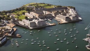 An aerial view of a historic port with a fortified structure, surrounded by a marina with numerous boats. - River views By Royal William Yard (Plymouth)
