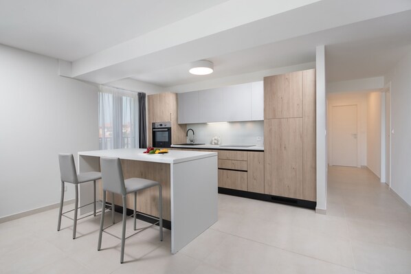 Superior Apartment, 2 Bedrooms | Private kitchen | Fridge, stovetop