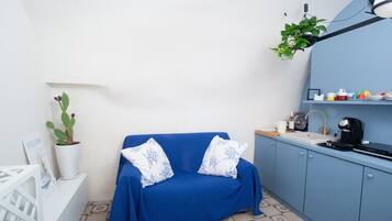 Apartment, 1 Bedroom | Living area | Flat-screen TV