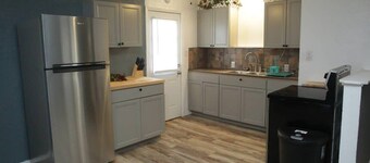 1 bedroom with a fireplace close to base