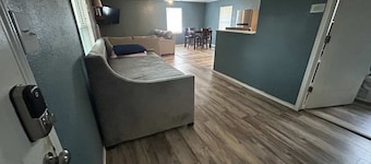 1 bedroom with a fireplace close to base