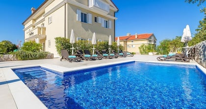 Elegant apartment Mande 1 with a terrace in villa on Krk