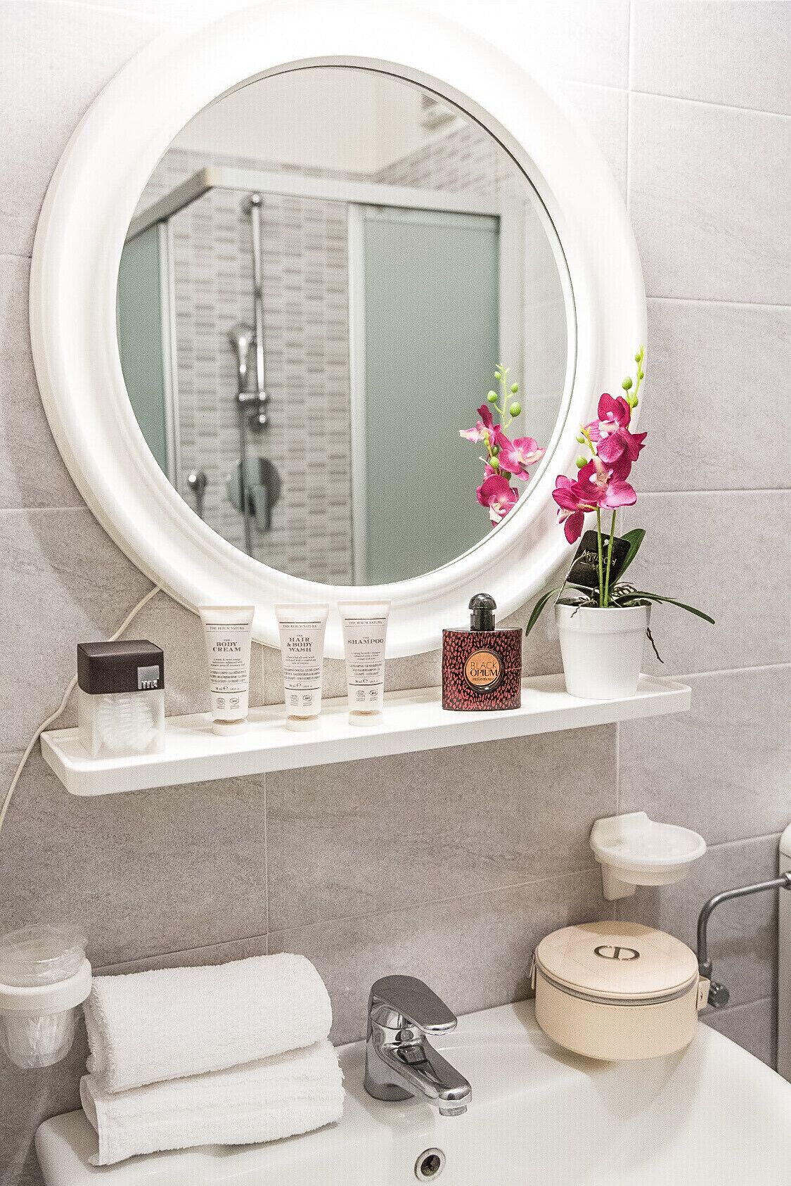 shower, hair dryer, bidet, towels