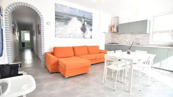 Apartment, 3 Bedrooms | Living room | Flat-screen TV