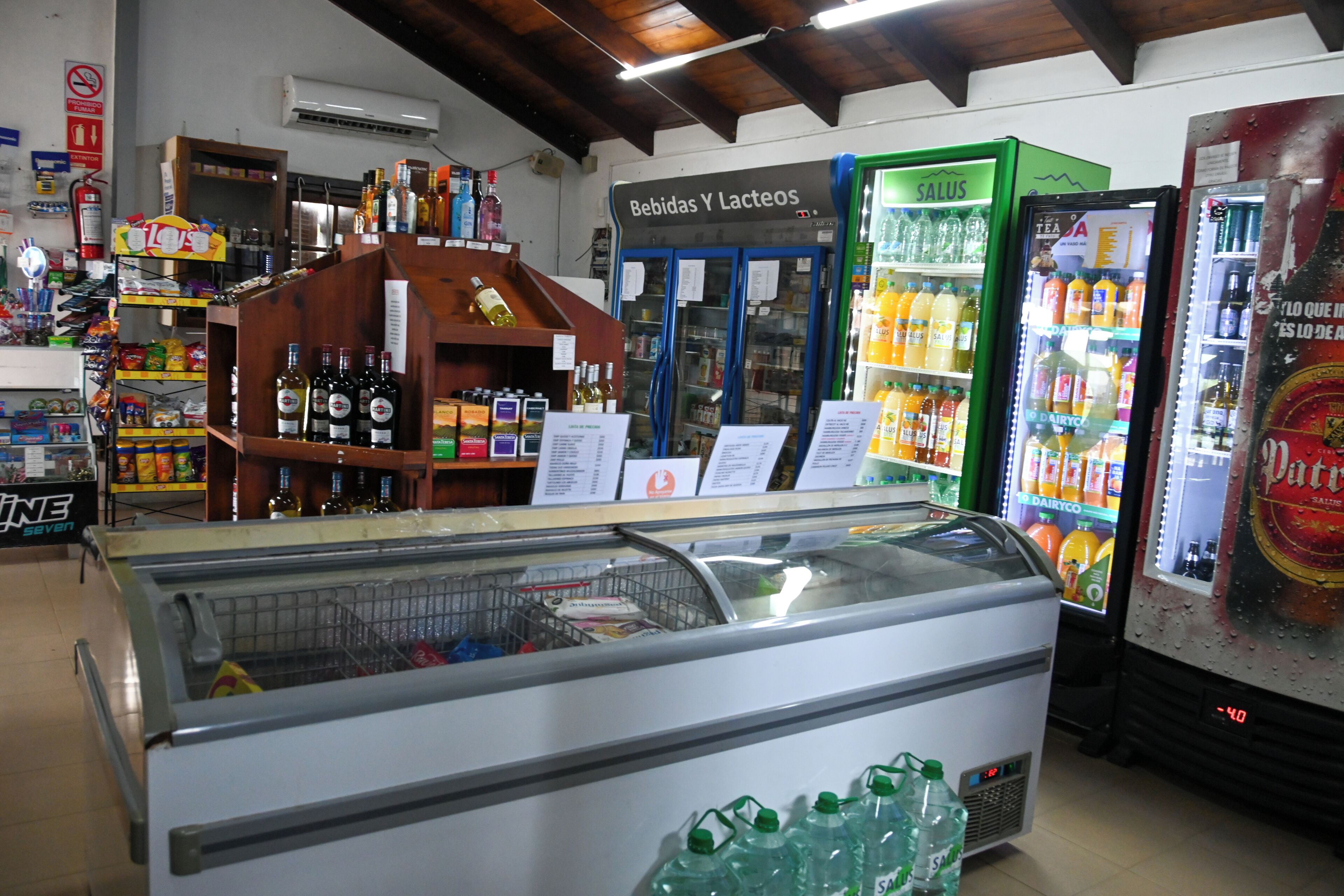 A refrigerated display case with various beverages, a selection of bottled drinks, and a refrigerated beverage dispenser.