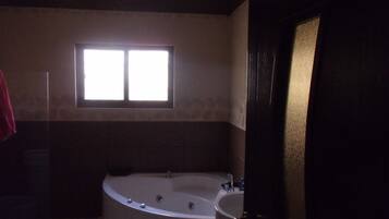 Shower, jetted bath, towels, soap