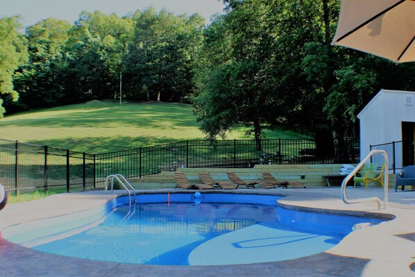 Seasonal outdoor pool, pool umbrellas, pool loungers