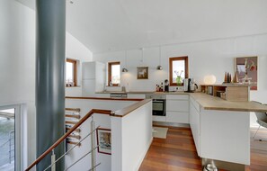 Fridge, stovetop, dishwasher, coffee/tea maker