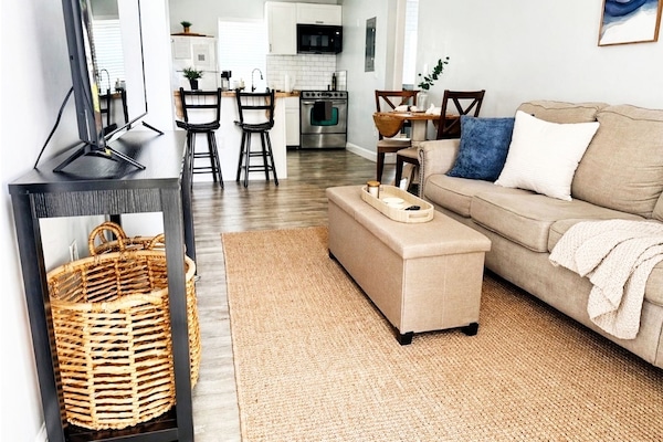 Living area looks into open kitchen