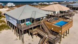 A beachfront house with a pool, multiple decks, and a view of the ocean. - Encantado | Cancellation 9/26 week. Pool! (Dauphin Island)
