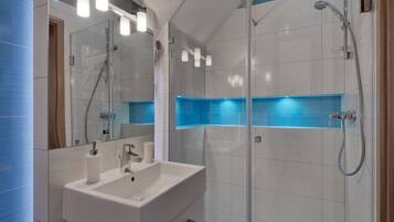 Shower, hair dryer, towels, soap