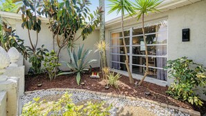 A well-maintained garden with various plants and a small fire feature. - 🌴 Great escape with private heated pool LOOK INSIDE  (Port Richey)