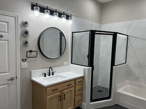 Bathtub, hair dryer, towels, soap