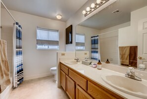 Combined shower/bathtub, hair dryer, towels, soap