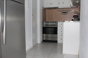 Fridge, oven, coffee/tea maker, cookware/dishes/utensils