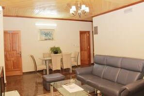 Luxury Apartment, 1 Bedroom | Living room | 43-inch TV with digital channels