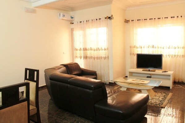 Luxury Apartment, 1 Bedroom | Living room | 43-inch TV with digital channels