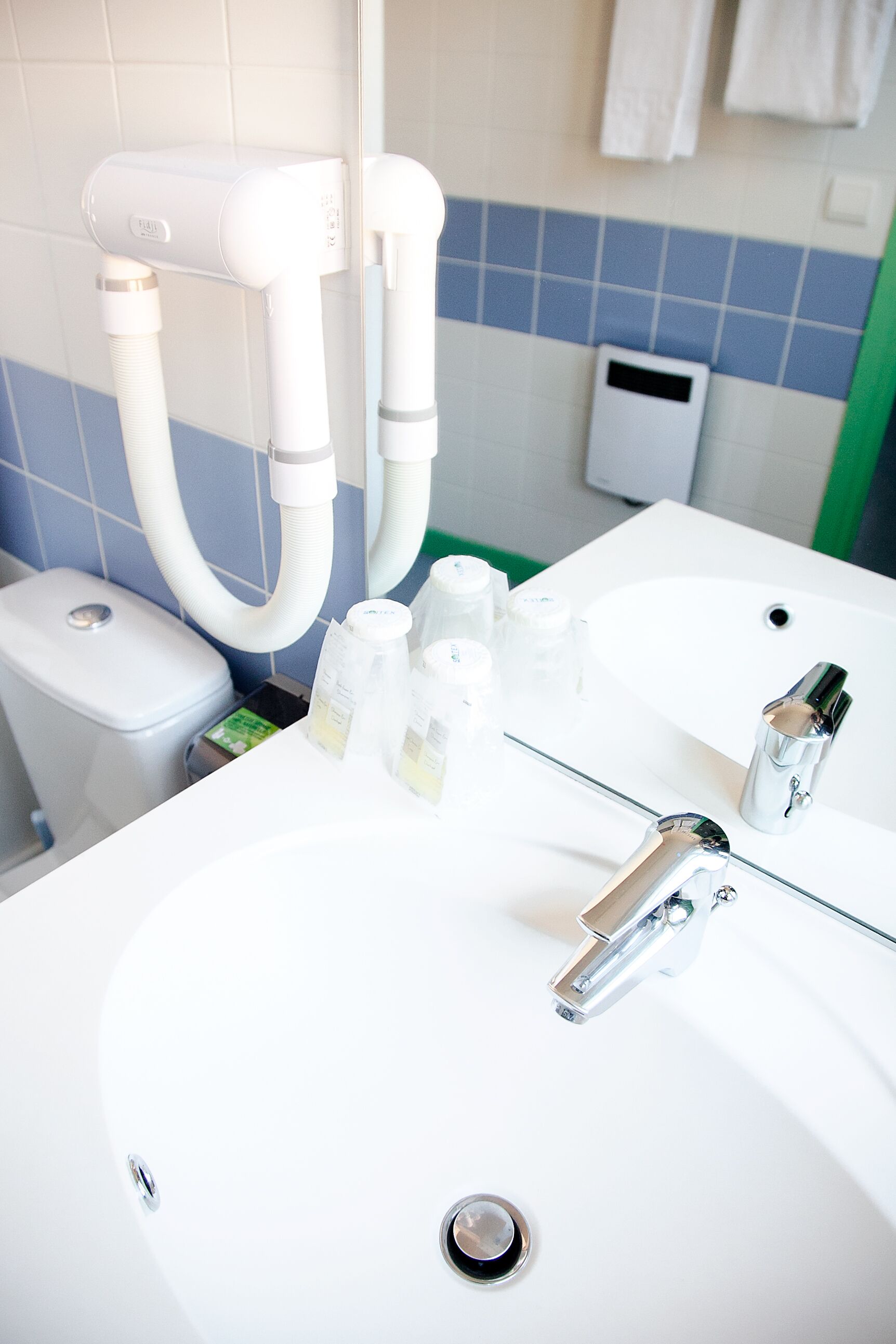 shower, rainfall showerhead, hair dryer, towels