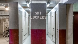 A row of lockers with a sign that reads "SKI LOCKERS". - Beautiful 2 bd/2 ba condo in the heart of town with all the amenities (Winter Park)