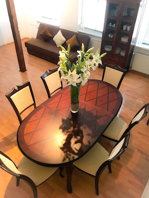 Enjoy meals in this cozy dining area with a round table and comfortable seating for four.
