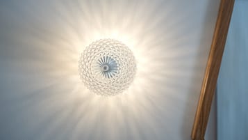 A ceiling light fixture with a geometric design.