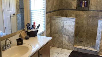 Combined shower/tub, hair dryer, towels, soap