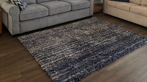 A living room with a grey sofa, a beige sofa, a patterned rug, a lamp, and a floral painting on the wall. - Spring Training 3B/2B close to everything (Mesa)