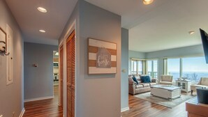 A spacious living room with a large window, a fireplace, and a cozy seating area. - WINTERGREEN RESORT HOME WITH BLUE RIDGE VIEWS (Wintergreen Resort)