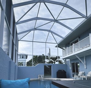 Outdoor pool, a heated pool - Dolphins, Sunsets & Waterfront Living – Heated Pool + Dock & Kayaks Near Beaches (Englewood)