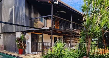 4 BEDROOM TROPICAL HOME + LAP POOL + PARKING FOR CARAVANS, BOATS OR TRAILERS.